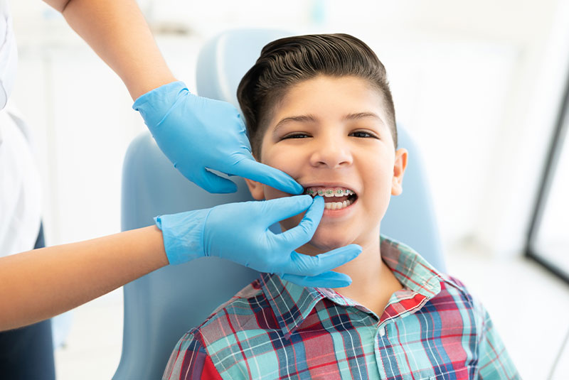 kid with braces