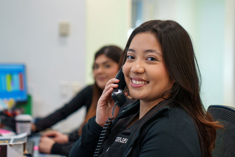 happily answering phone call