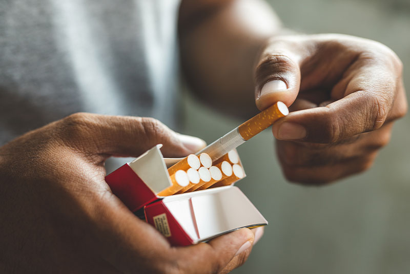 person smoking cigarette