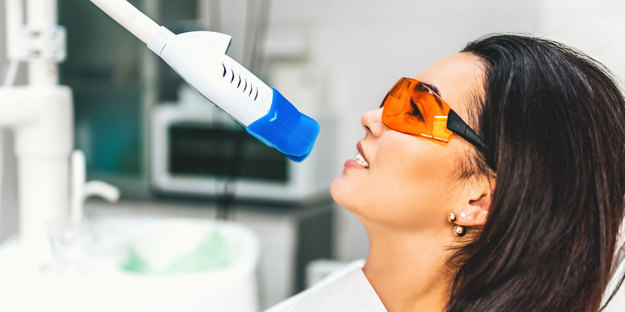 woman getting teeth whitening